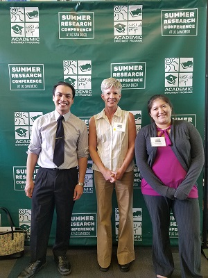 Prof Ripley standing with Nial-Conor Garcia and Staphanie Aguiar at the UCSD Summer Research Conference
