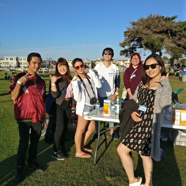 Students enjoying a day at the beach with BBQ